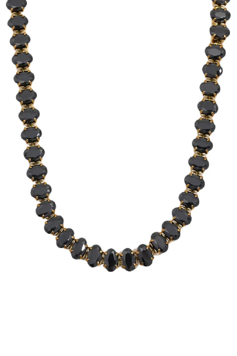 Necklace with black beads on a white background