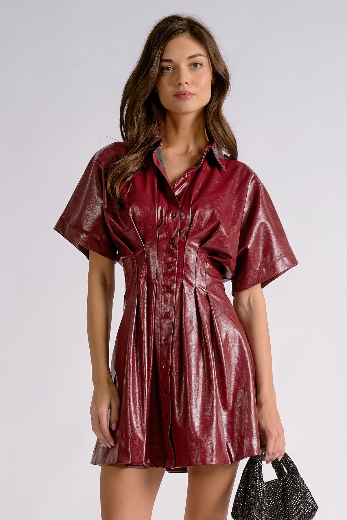 Front view of Elan oxblood faux leather mini shirtdress with short sleeves