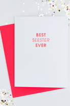 Greeting card with 'Best Seester Ever' text on a white background with red border