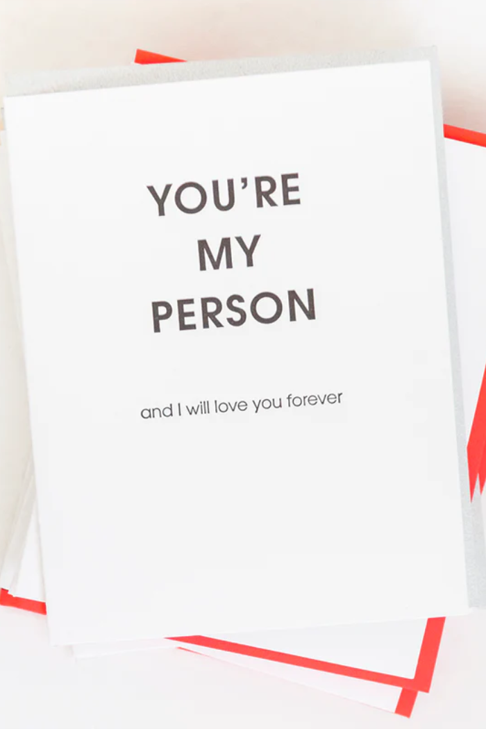 White pillow with text 'YOU'RE MY PERSON and I will love you forever' on a white background