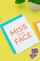 Card with 'Miss Your Face' text on a yellow background