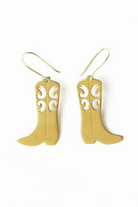 Gold cowboy boot earrings on a white background