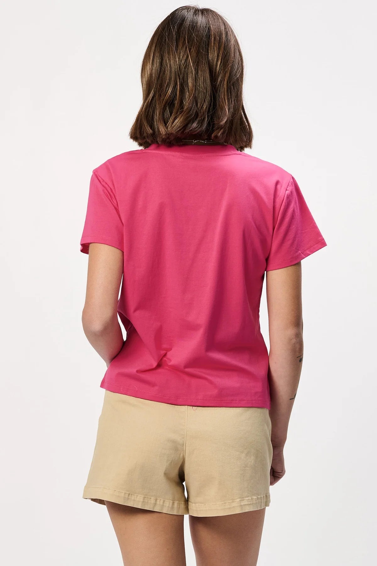 Another Love Amaya Tee in hot pink, back view, paired with tan shorts
