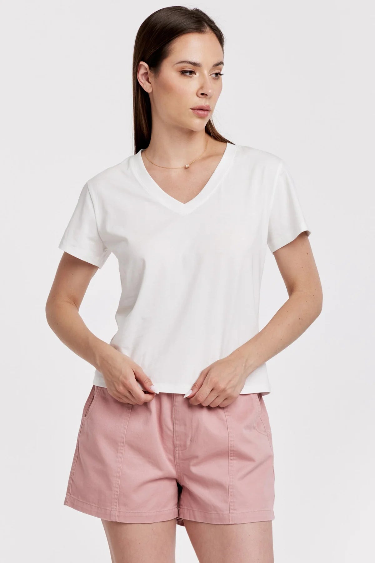 Another Love Amaya Tee in white v-neck, front view, paired with pink shorts