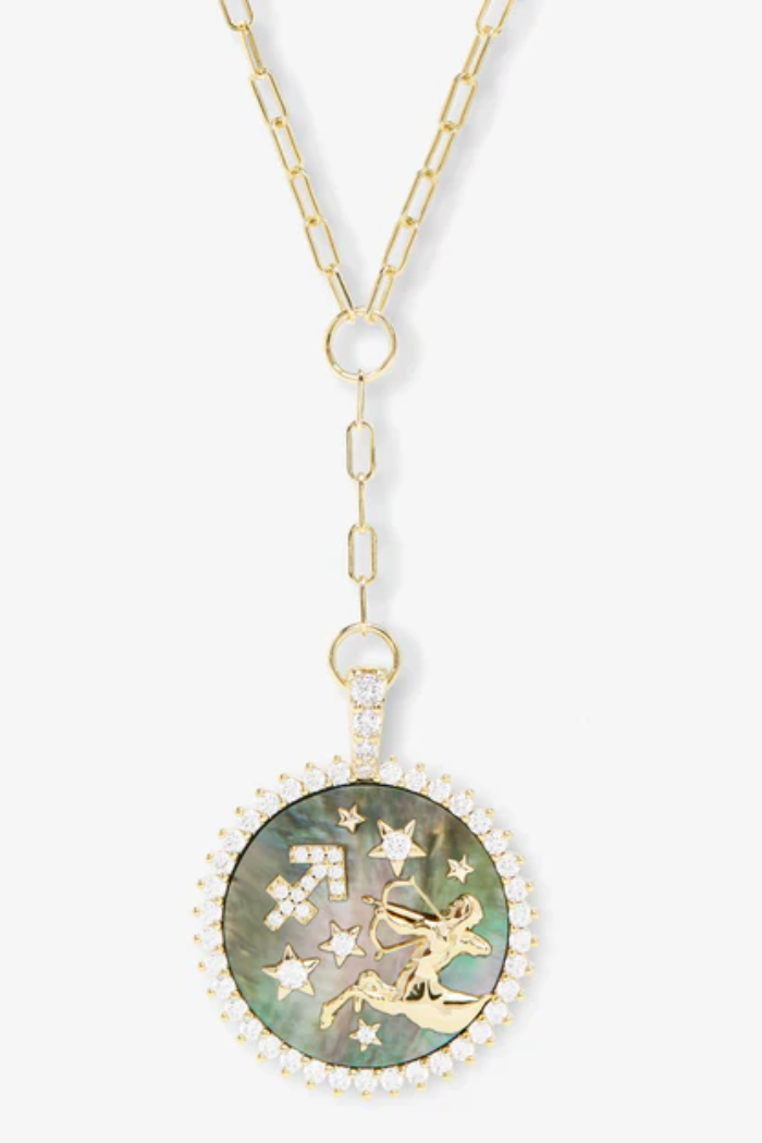 Necklace with a round pendant featuring a celestial design on a white background