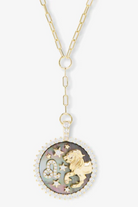 Necklace with a round pendant featuring a lion and star design on a white background
