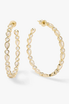 Gold hoop earrings with pearl-like stones on a white background