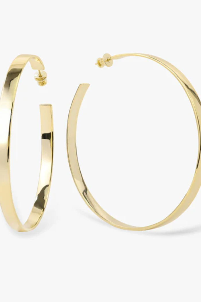 Gold hoop earrings on a white background
