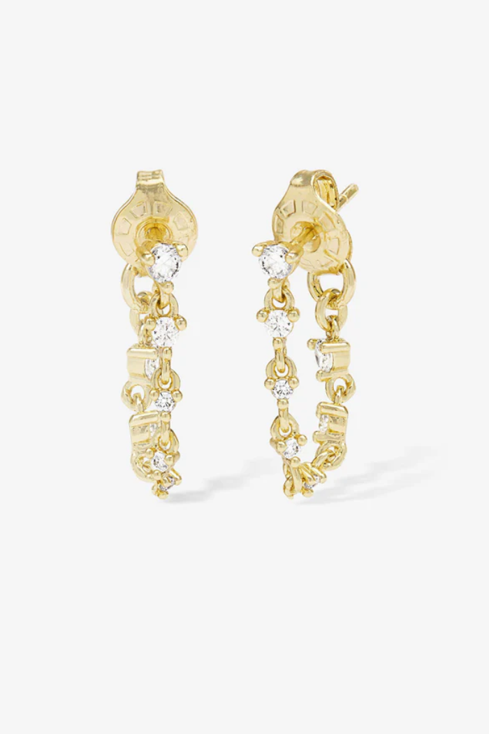Gold earrings with chain design and small diamonds on a white background