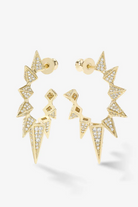 Gold hoop earrings with geometric designs on a white background
