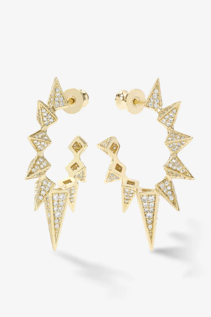 Gold hoop earrings with geometric designs on a white background