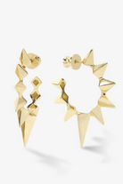 Gold geometric earrings on a white background