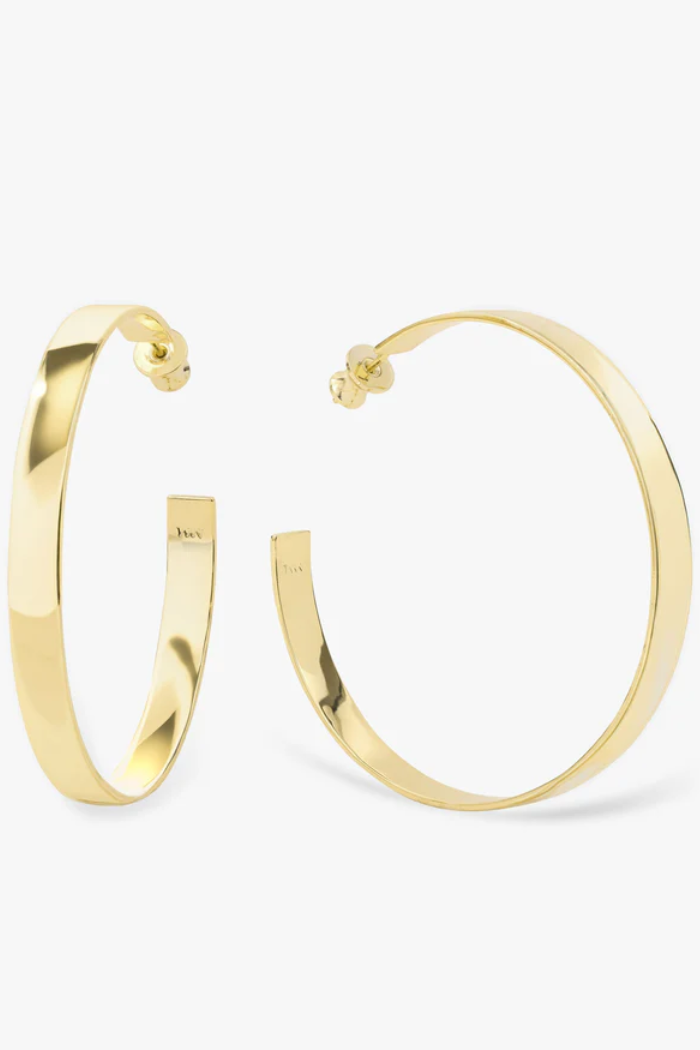 Gold hoop earrings on a white background