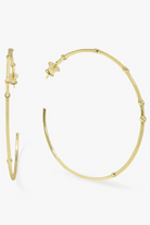 Gold hoop earrings on a white background