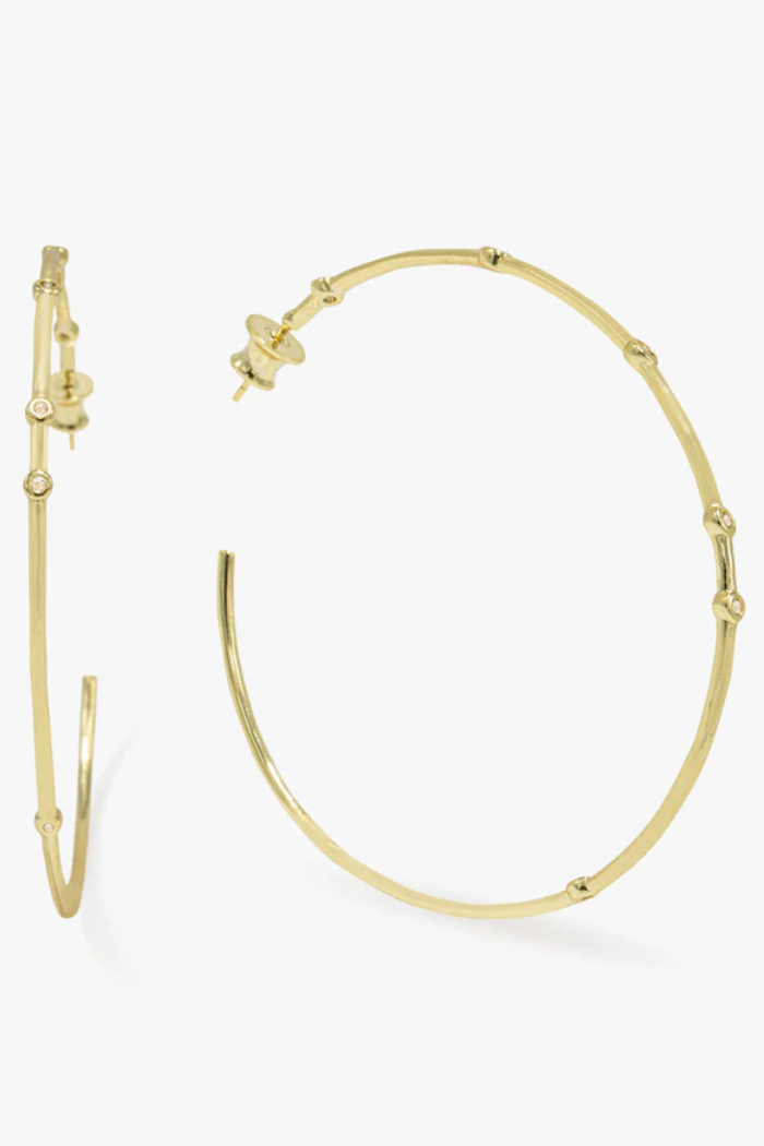Gold hoop earrings on a white background