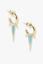 Gold and blue earrings on a white background
