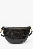 Black textured handbag with gold zipper on a white background