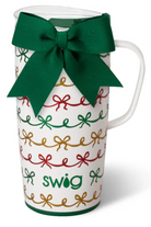 White mug with colorful bow patterns and a green bow, branded 'swig', on a white background.