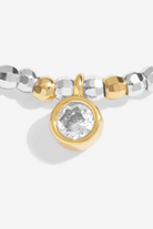 Bracelet with silver and gold beads on a white background