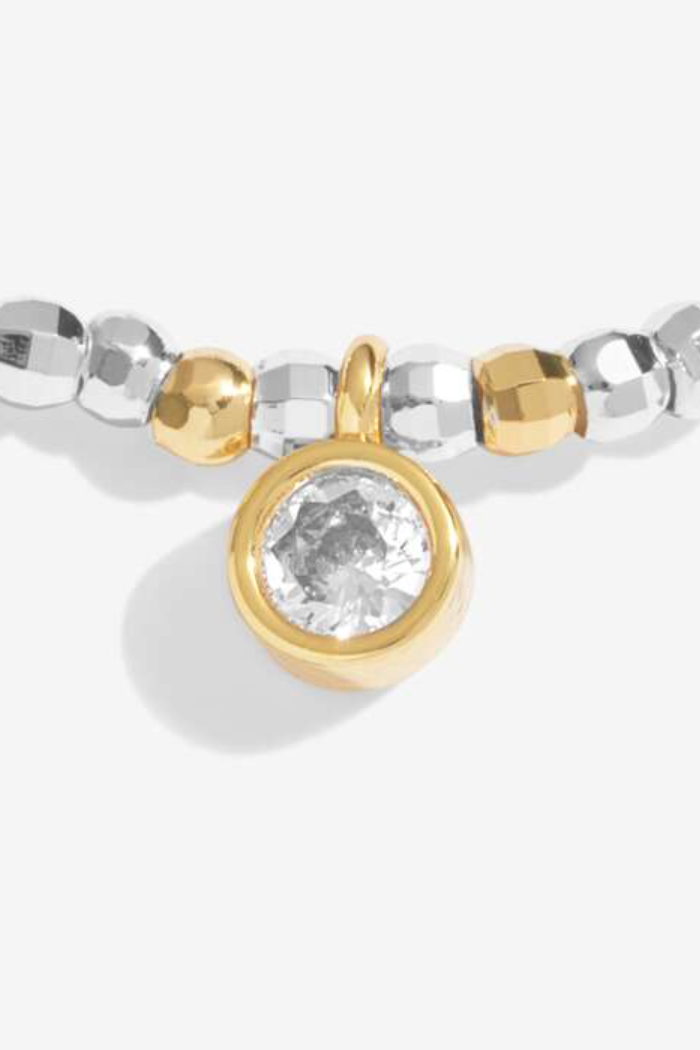 Bracelet with silver and gold beads on a white background