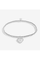 Silver bracelet with a heart-shaped charm on a white background