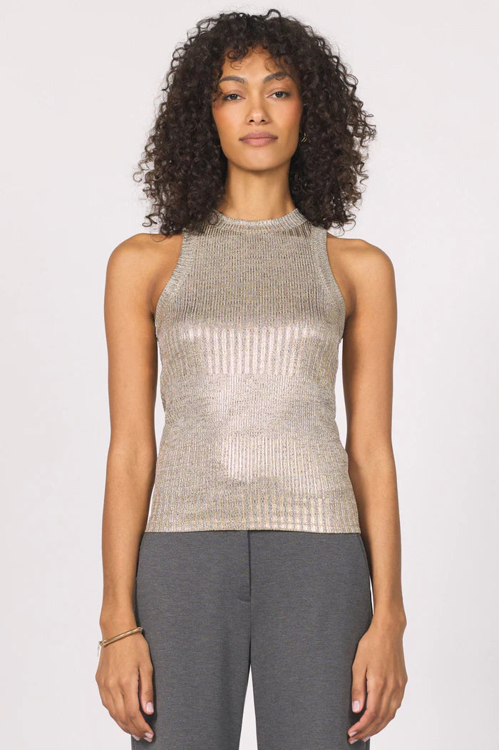 Woman wearing a metallic sleeveless top against a plain background