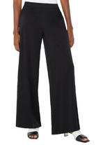 Black wide-leg pants worn by a person on a white background