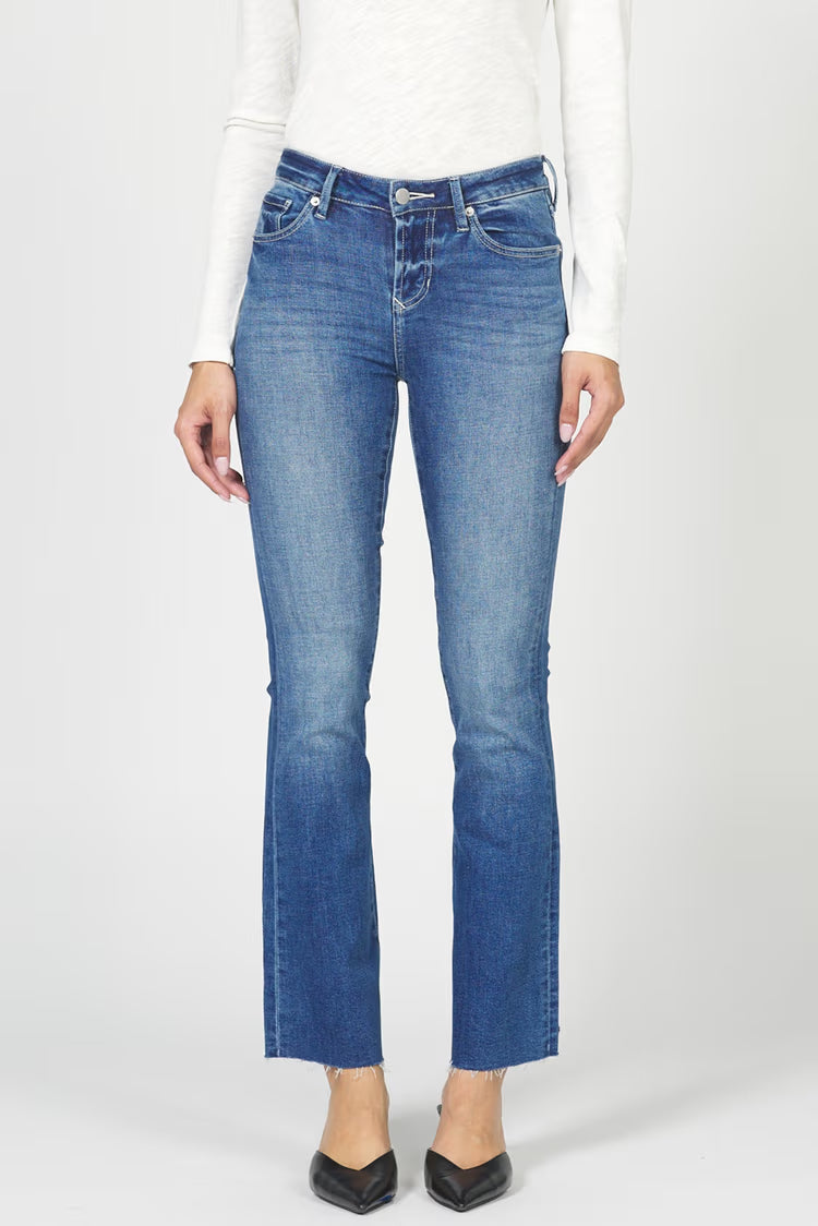 Person wearing blue jeans on a white background