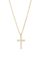 Gold cross necklace with clear stones on a white background