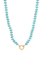 Turquoise beaded necklace with a gold clasp on a white background