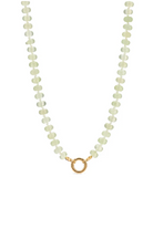 Necklace with light green beads and a gold clasp on a white background
