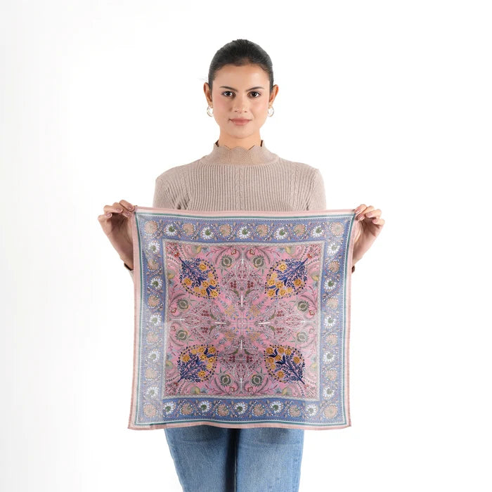 Woman holding open Florentine Bandana in peach pink and blue floral print