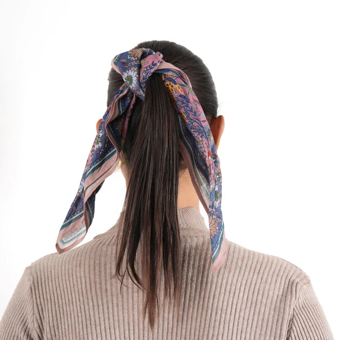 Florentine Bandana in peach blue tied around dark ponytail, back view