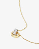 Close-up of Ashley Duo Necklace gold beaded chain two-tone diamond interlocked ring pendant