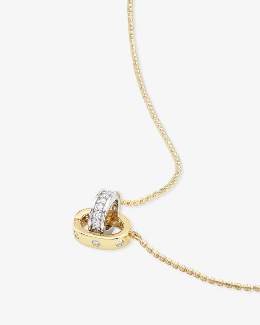 Close-up of Ashley Duo Necklace gold beaded chain two-tone diamond interlocked ring pendant