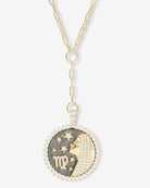 Melinda Maria gold Virgo zodiac medallion necklace with black mother-of-pearl and crystal halo on white background