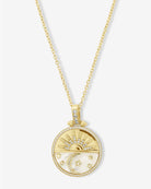 Melinda Maria gold New Beginnings Medallion Necklace with sun, crescent moon, stars, and crystal halo on white background
